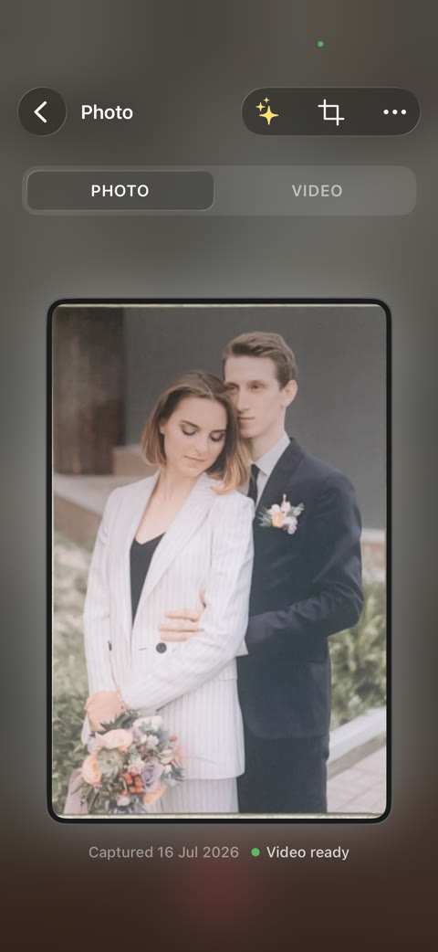 A scanned wedding photo on its detail screen, marked ready to play as video